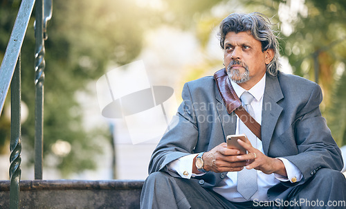 Image of Phone, thinking and a business man on steps in the park during a work break for communication. Mobile, idea and mockup with a mature employee looking worried after job loss in a financial crisis
