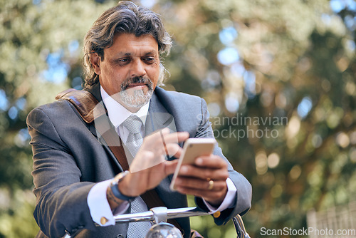 Image of Bike travel, nature and a businessman with a phone for an email, reading communication and chat. Relax, commute and a mature employee with a bicycle and a mobile for a notification in the morning