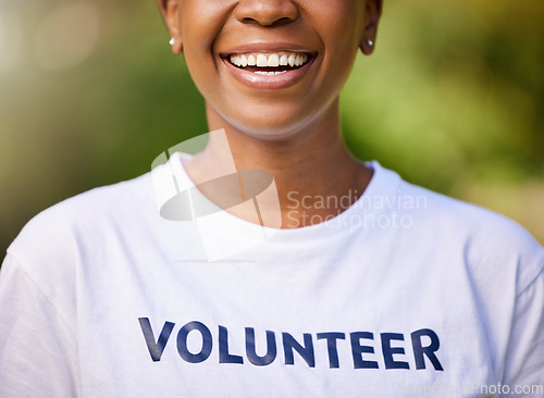 Image of Woman, smile and happy volunteering in park or nature for climate change, earth day or environment. Mouth of person in community service, green NGO or nonprofit tshirt for outdoor support and helping