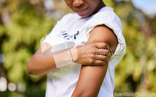 Image of Woman, arm injury and pain in nature from accident, tension or outdoor muscle cramp. Closeup of female person or volunteer worker with sore ache, discomfort or joint inflammation in nature