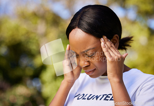 Image of Black woman, headache and stress in mistake, debt or burnout from volunteer work in outdoor nature. Frustrated African female person with migraine, sore bruise or injury in community service in park