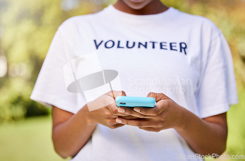 Image of Person hands, phone typing and volunteering in park with social media FAQ, blog or community service chat. Volunteer on search mobile for earth day communication, NGO or nonprofit contact in nature