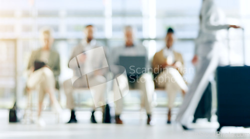 Image of Technology, airport group and waiting room of business people typing, scroll or reading online plane flight booking. Airplane transport journey, blurred lobby and traveler on tablet, laptop or phone