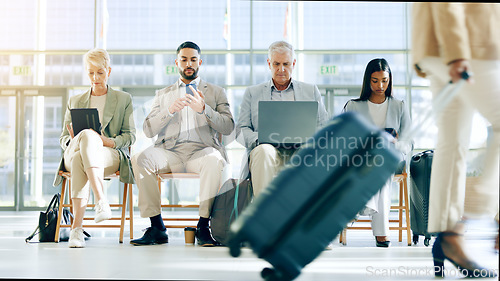 Image of Technology, airport and waiting room row of business people check plane schedule, travel flight booking or transport journey. Airplane departure, lobby and group work on tablet, cellphone or phone