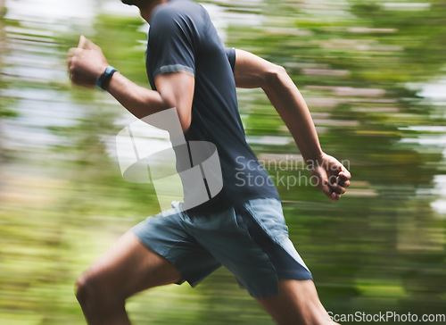 Image of Man, motion blur and running in park for exercise, fitness action and power of cardio workout. Closeup, runner and sports athlete training for marathon with energy, speed and fast performance outdoor