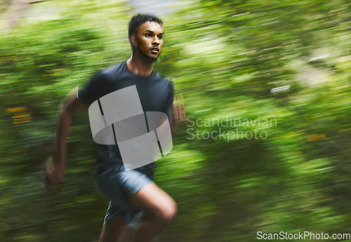 Image of Sports man, speed and running in park with motion blur, cardio workout and fitness action. Runner, athlete and focus for marathon race with energy, dynamic exercise and fast performance pace outdoor