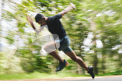 Image of Running, fitness and blur of man in forest for marathon training, exercise and cardio workout. Sports, race and athlete with speed for wellness, performance and endurance for challenge in nature