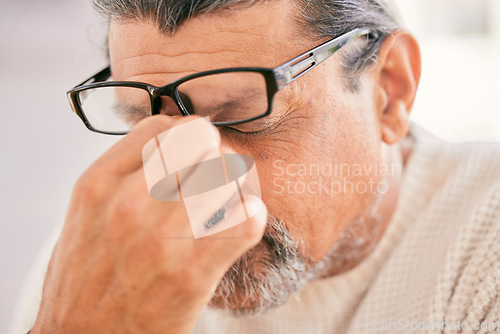 Image of Frustrated senior man, headache and debt in stress, burnout or financial crisis at home. Mature male person with migraine, eye strain or anxiety in depression, mental health or pain or overworked