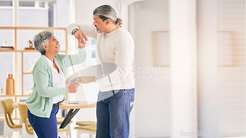 Image of Mature couple, dancing and happy at home for anniversary, birthday or valentines celebration. Laugh, love and care of a man and woman for healthy marriage, happiness and romance with mockup space