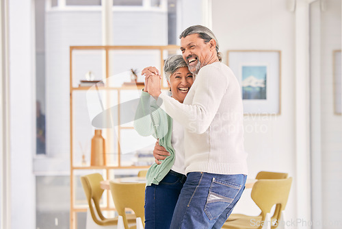 Image of Dancing, mature couple and happy at home for anniversary, birthday or valentines celebration. Laugh, love and care of man and woman for healthy marriage, happiness and moving to music or funny laugh