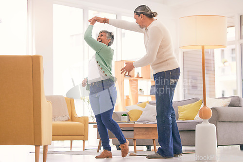 Image of Happy, mature couple and dancing at home for anniversary, birthday or valentines celebration. Laugh, love and care of man and woman for healthy marriage, happiness and moving or spin with a smile