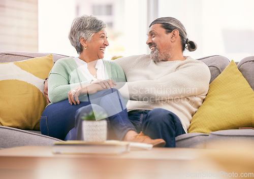 Image of Happy, mature couple and relax on sofa in home for love, care and bonding together with marriage partner. Man, woman and hug on couch with smile, support and loyalty for relationship in living room