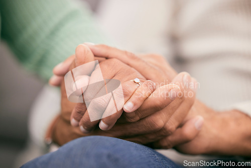 Image of Couple holding hands for support, love and care of trust together in marriage relationship at home. Closeup of man, woman and helping hand of life partner with loyalty, commitment or hope for empathy