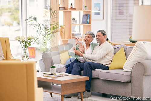 Image of Happy, couple and video call on tablet in home with voip communication, social network and webcam on sofa. Mature man, woman and wave hello for virtual conversation of digital contact in living room