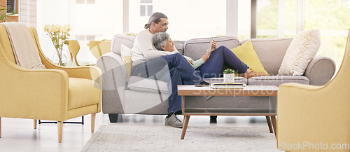 Image of Mature couple, relax and together on sofa with tablet for streaming a film, show or movie in home, lounge or living room. Love, man and woman in retirement watching tv on mobile app or social media