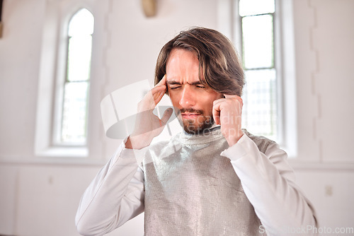 Image of Stress, fencing and challenge with man and headache for pain, thinking and migraine. Mental health, frustrated and sports with male athlete with anxiety about tournament problem, training and sick