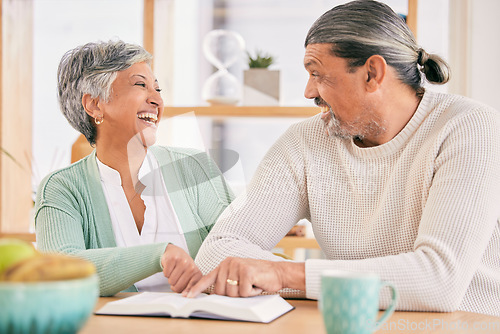 Image of Reading, book and senior couple at home with bible study and religion together in marriage. Laughing, happy and elderly people with worship, learning and christian conversation with love and care