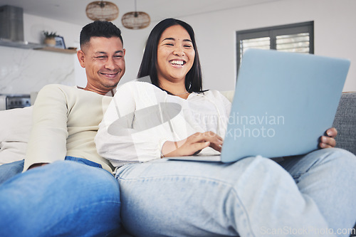 Image of Smile, laptop and couple networking on a sofa to relax in the living room of their modern house. Happy, love and young man and woman watching a funny video on the internet with a computer at home.