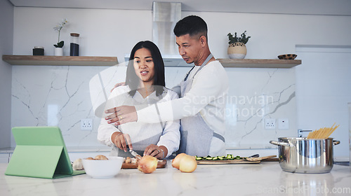 Image of Digital tablet, cooking and couple in a kitchen, talking and bonding with love, marriage and fun activity. Home, man and woman with tech, online recipe and video with instructions and prepare a meal