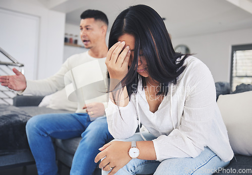 Image of Frustrated couple, headache and fight in divorce, conflict or disagreement on living room sofa at home. Unhappy man and woman in breakup, cheating affair or dispute from toxic relationship in house