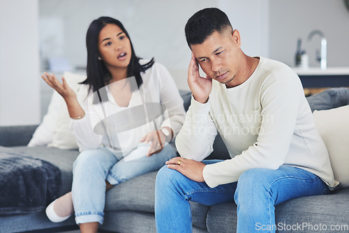 Image of Frustrated couple, headache and disagreement in divorce, conflict or argument on living room sofa at home. Unhappy man and woman in breakup, cheating affair or fight from toxic relationship in house