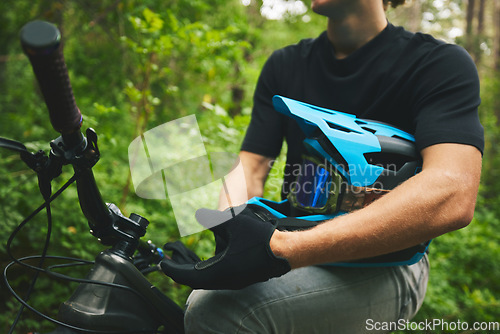 Image of Mountain bike, man and helmet, glove in forest and sports, adventure and fitness in nature outdoor. Cycling, biker and travel with athlete, exercise training and ready to ride, bicycle and challenge