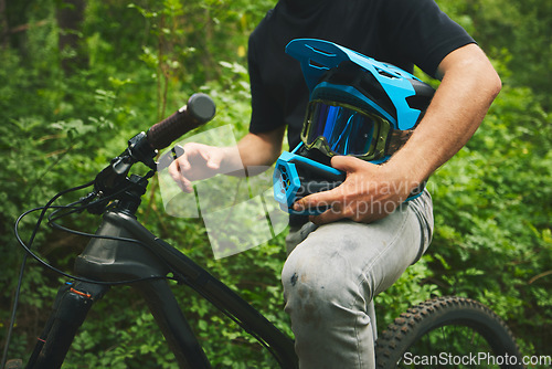 Image of Mountain bike, man and helmet, forest and sports with adventure and fitness in nature outdoor. Cycling, biker and travel with athlete, exercise training and ready to ride, bicycle and challenge