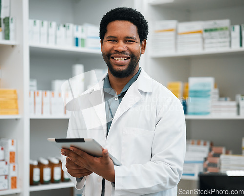 Image of Pharmacy portrait, pharmacist man and tablet in medicine management, stock research or inventory shelf. Digital technology, retail software and healthcare doctor or african person in medical services