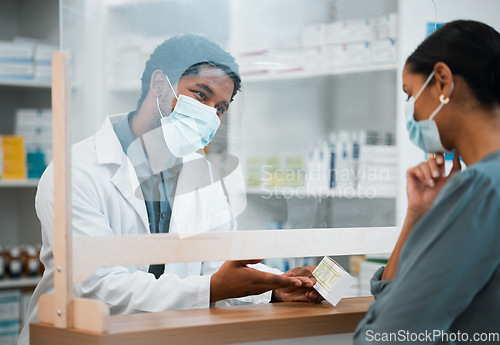 Image of Pharmacy, face mask or black man giving pills to woman patient in customer service for wellness advice. Healthcare help, African pharmacist or doctor with pharmaceutical medicine or medical product