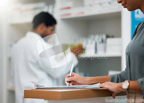 Image of Woman at pharmacy, clipboard and medical insurance information at counter for script for prescription medicine. Paperwork, writing and patient at pharmacist with application for pharmaceutical drugs.