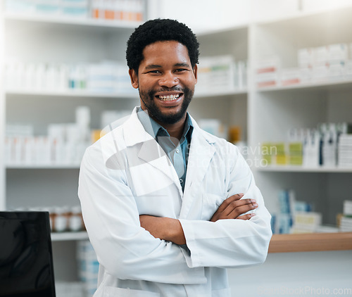 Image of Pharmacist, black man and arms crossed for healthcare, medicine and clinic solution, service and support. Happy portrait of medical worker in pharmacy for drugs, product inventory and retail mindset