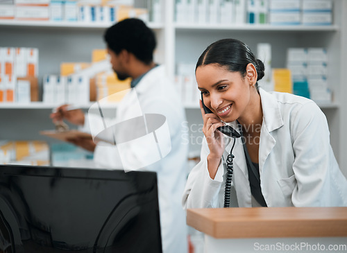 Image of Pharmacist, woman and telephone for medicine stock, customer support and inventory communication or retail service. Medical worker or doctor on phone call and computer for pharmacy or healthcare FAQ