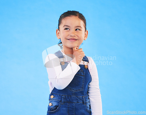 Image of Thinking, child and girl with ideas, solution and problem solving on a blue studio background. Mockup space, kid and model with planning, emoji and inspiration with decision, choice and opportunity