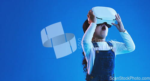 Image of Wow, virtual reality and futuristic with girl, glasses or online gaming on blue studio background. Internet, surprise or child with vr headset, mockup space or digital transformation with video games