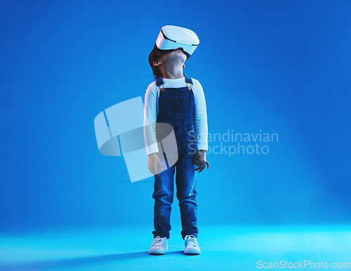 Image of Glasses, virtual reality or technology with girl, futuristic or digital transformation on blue studio background. Kid, person or model with vr headset, metaverse or augmented reality for online games