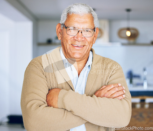 Image of Senior man, portrait and retirement house with arms crossed and smile from elderly care. Confidence, relax and living room room with male person from Mexico with glasses and happy in a old age home