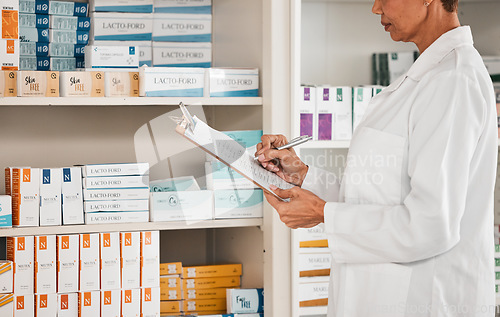 Image of Woman, pharmacist and writing on clipboard for inventory inspection on pills, tablets or medication on shelf at pharmacy. Female person or medical worker checking stock or pharmaceutical at drugstore