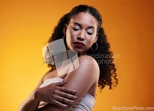 Image of Beauty, hair and makeup with face of woman in studio for texture, fashion and cosmetics. Self care, salon and hairstyle with model on orange background for skincare, spa treatment and glow mockup