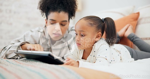 Image of Tablet, elearning and mother with girl in bedroom, education and bonding in home. Tech, happy and African mom with child on bed for streaming movie, video or film on social media to relax together.