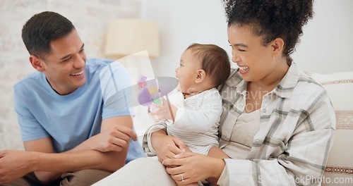 Image of Couple, family and quality time with baby, mom and dad playing with toys for fun, laughing together in home, bedroom or nursery. Newborn, infant and happiness in motherhood, family or child smile