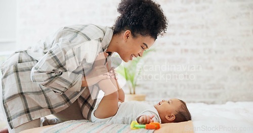 Image of Mother, baby or child with a toy for development, learning and growth in family home. Cute toddler or infant kid with woman or parent for love, care and security while playing for mobility in bedroom