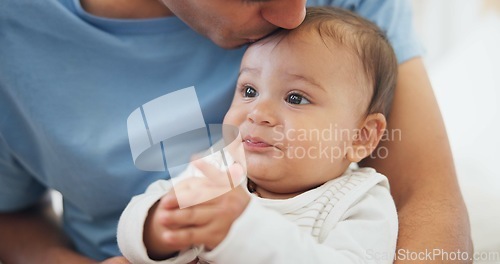 Image of Father, baby and kiss in home for love, care and affection, bonding together and cute. Dad, newborn and smooch kid, infant or toddler, relax and enjoying quality family time with parent in house.