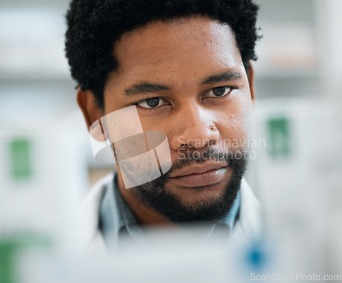 Image of Black man, face and pharmacist, drugs and health with medicine, prescription and organize stock in pharmacy. Pills, healthcare and African medical employee, hospital dispensary and pharmaceutical