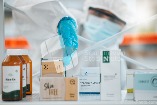 Image of Drugs, pharmacy and disinfection, person in PPE for hygiene and cleaning, safety from bacteria and virus. Covid, compliance and healthcare, pharmaceutical and sanitize with cleaner and chemicals