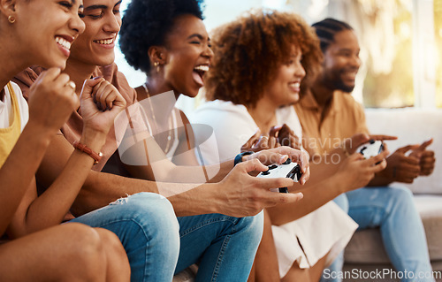 Image of Group of friends together on sofa, video game fun and relax in home living room playing with internet controller. Online gaming, virtual esports app and couch happy gamer men and women in apartment.