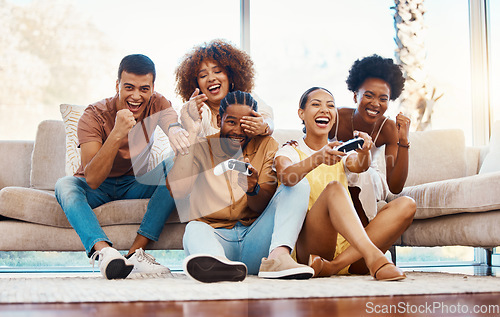 Image of Group of friends on sofa, celebration and video game, fun and relax in home living room together with internet controller. Online gaming, esports app and couch happy gamer men and women in apartment.