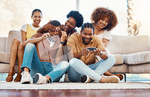 Image of Group of friends on couch, video games for fun and relax in home living room together with internet controller. Online gaming, playing esports app and sofa, happy gamer men and women in apartment.