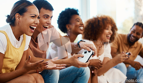 Image of Friends together on sofa, video game fun and relax in home living room playing with internet controller. Online gaming, virtual esports app and couch happy group of gamer men and women in apartment.