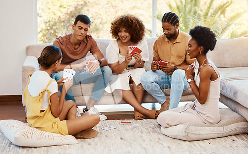 Image of Game, smile or friends playing cards, poker or black jack at home for gambling together in a holiday party. Happy, men or group of women laughing to relax in living room in a fun match competition