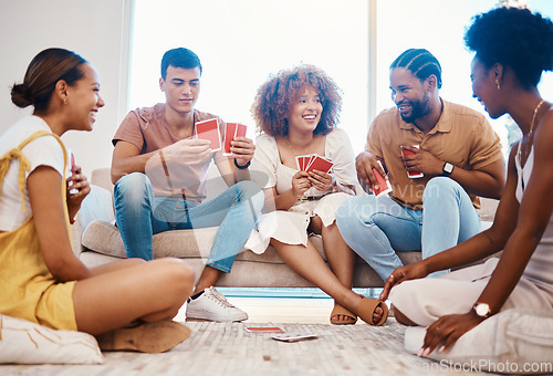 Image of Game, laughing or friends playing cards, poker or black jack at home gambling together in a holiday party. Happy people, men or group of funny women relax in living room in a fun match competition